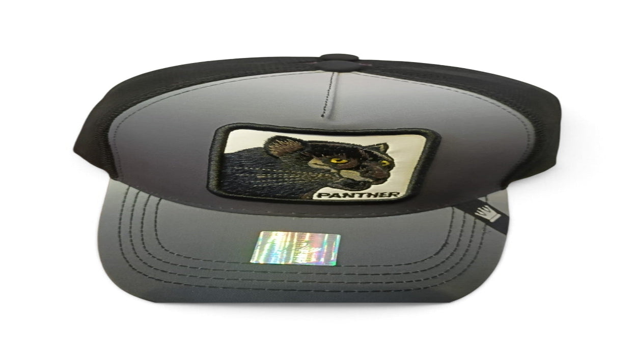 A dark gray and black trucker-style cap featuring a square embroidered patch of a panther on the front. The patch includes the word 'PANTHER' and is set against a plain white background.
